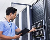 Man standing in front of a computer server