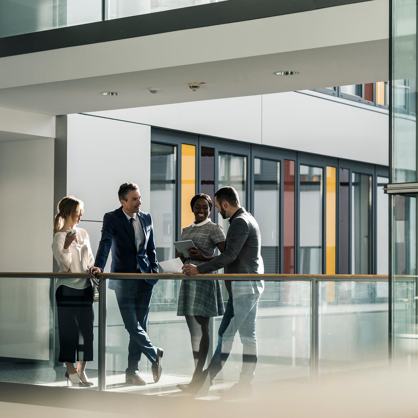 Business people talking on office floor 