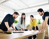 A group of people in a modern office having a meeting