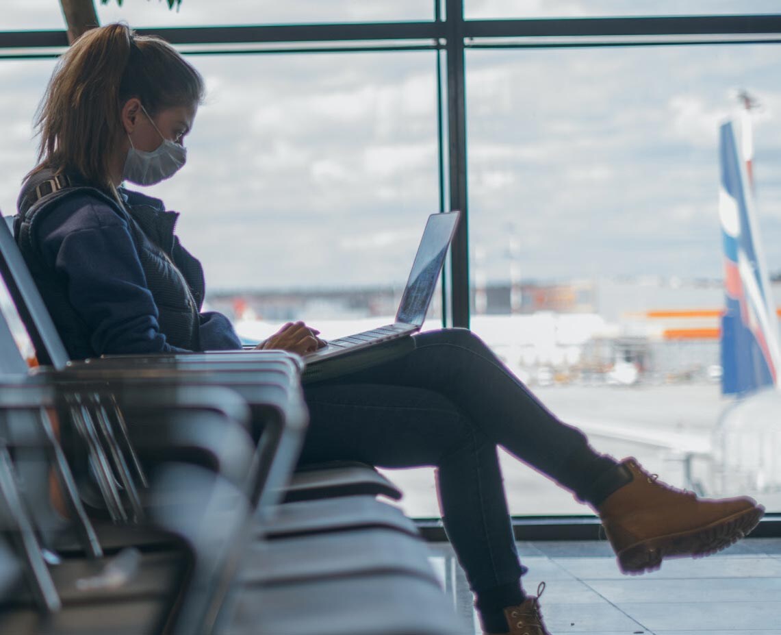 person sitting at airport terminal