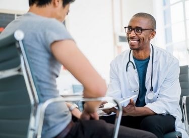 Doctor smiling at patient