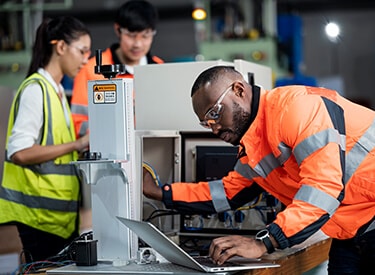 Engineers working in a machine workshop