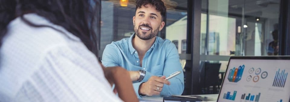 Man pointing at research dashboard