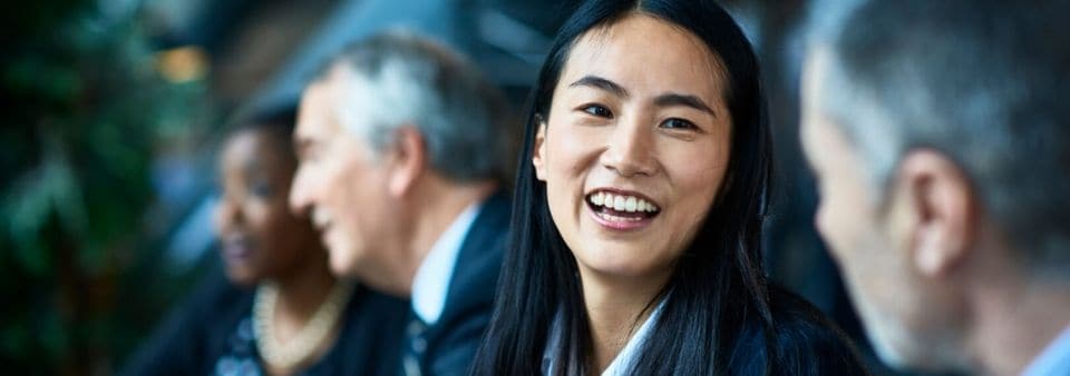 Woman in business meeting smiling