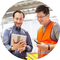 two men with tablet talking