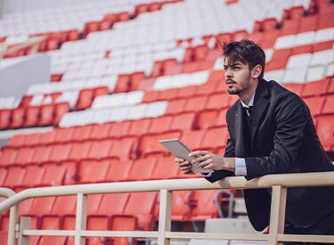 Event planner sat in a stadium