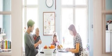 family-sitting-down-at-table