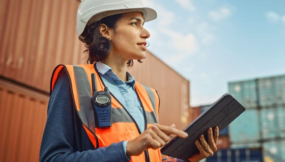 female with hardhat at shipping yard