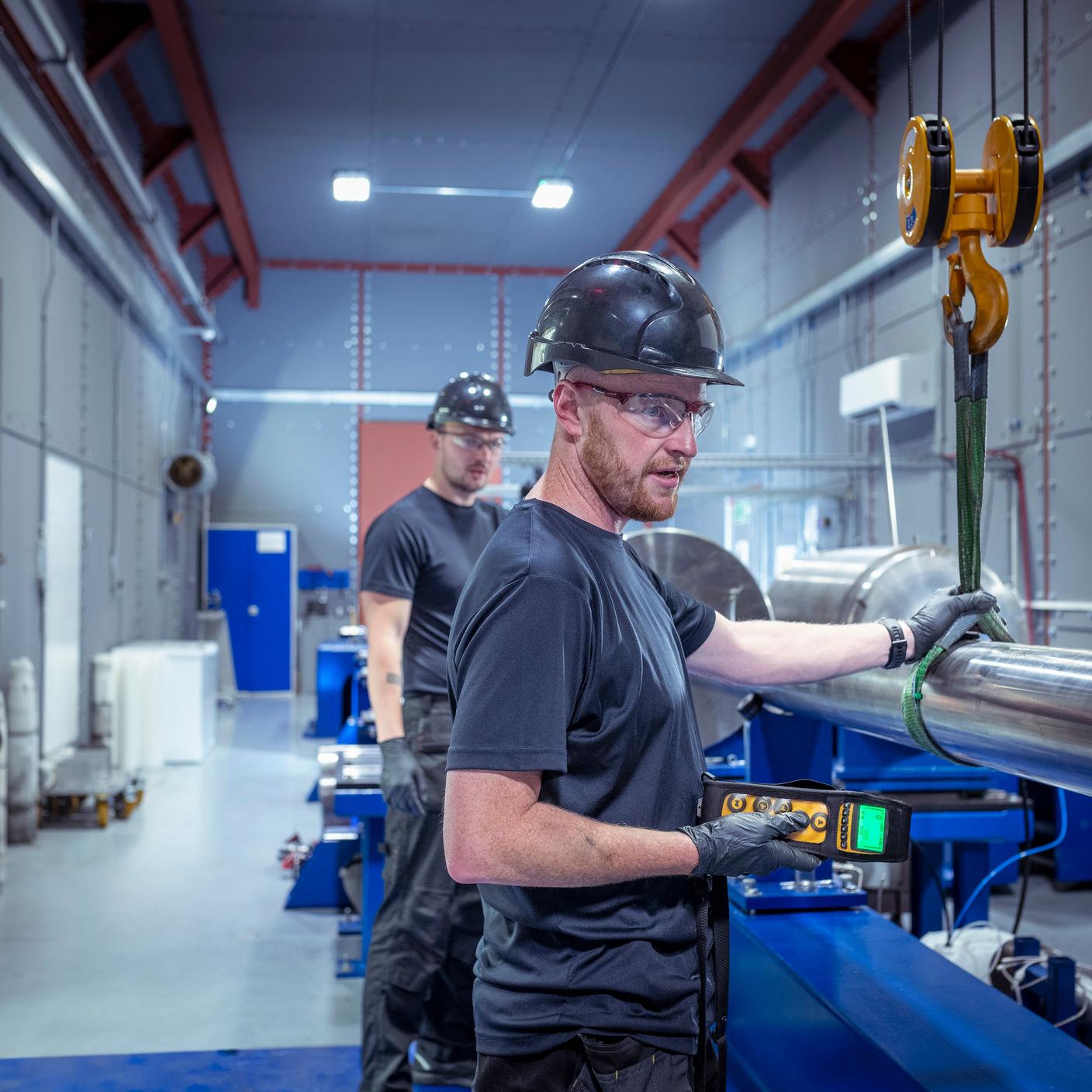 Innovation in Energy - Engineers fitting new barrel to a two stage gas gun