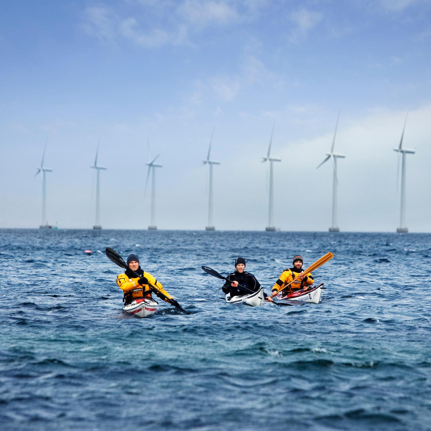 people in canoes in the sea