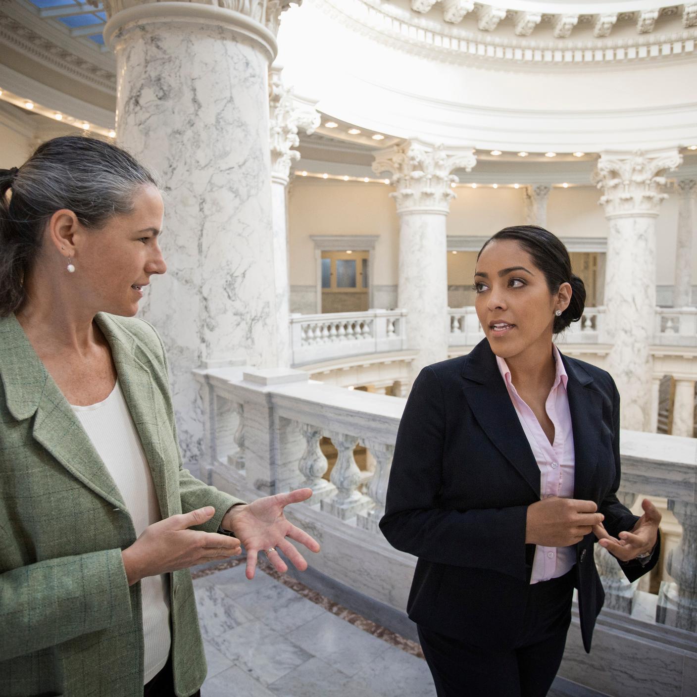 Politicians talking in government building