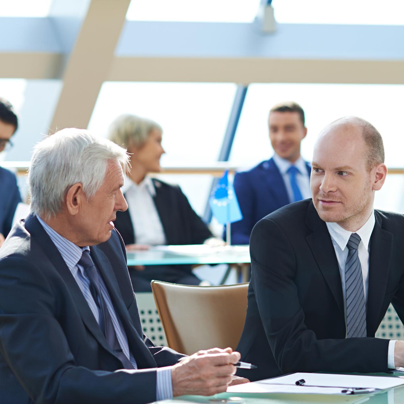 Businessmen talking during business conference