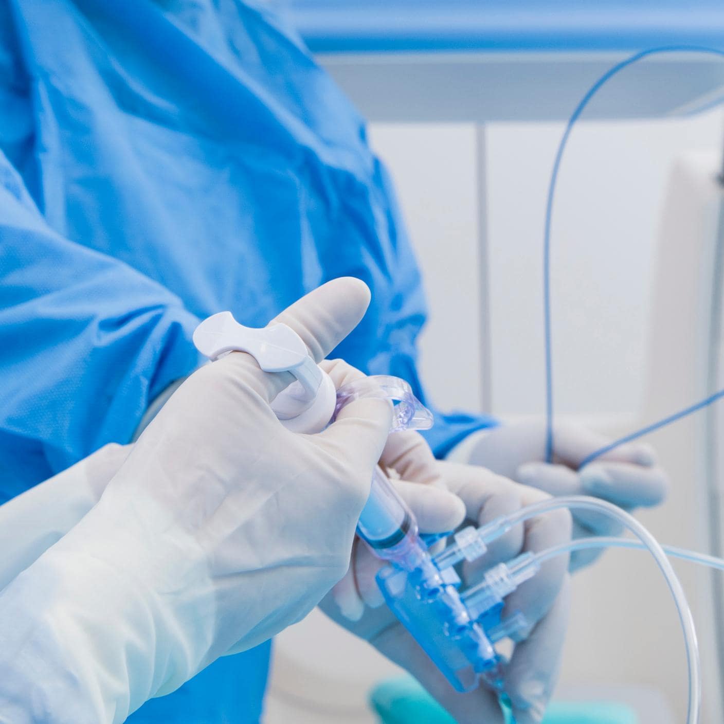 doctor injecting with needle to tube