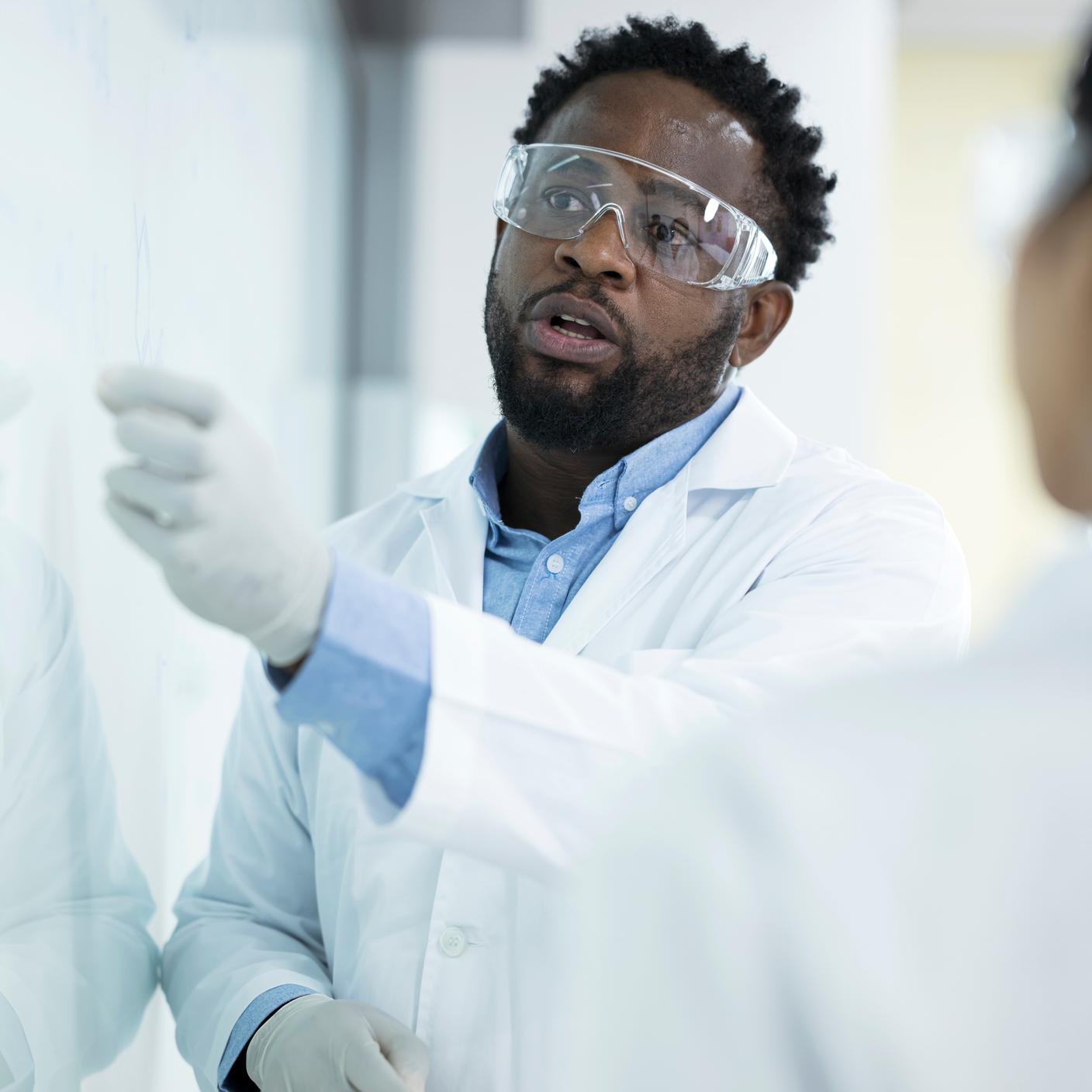 Healthcare - scientist using whiteboard