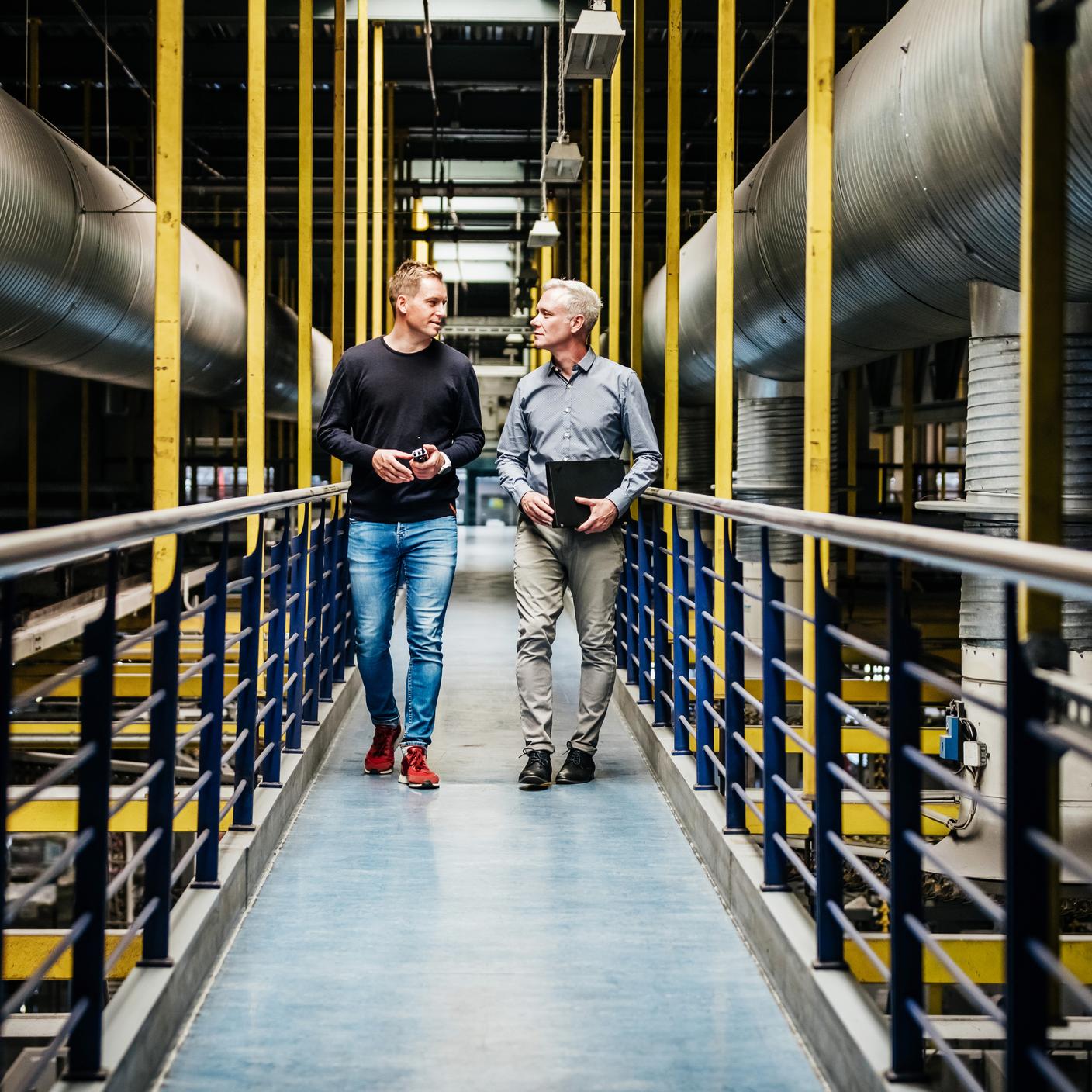 Engineers walking through plant 