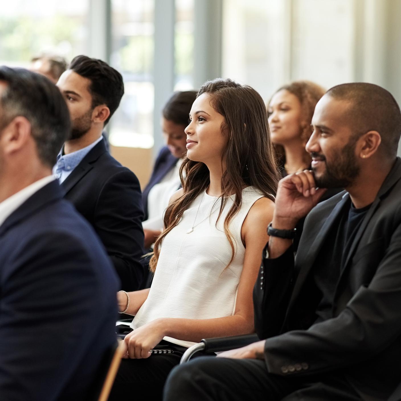 Consumer standards - business people listening at conference