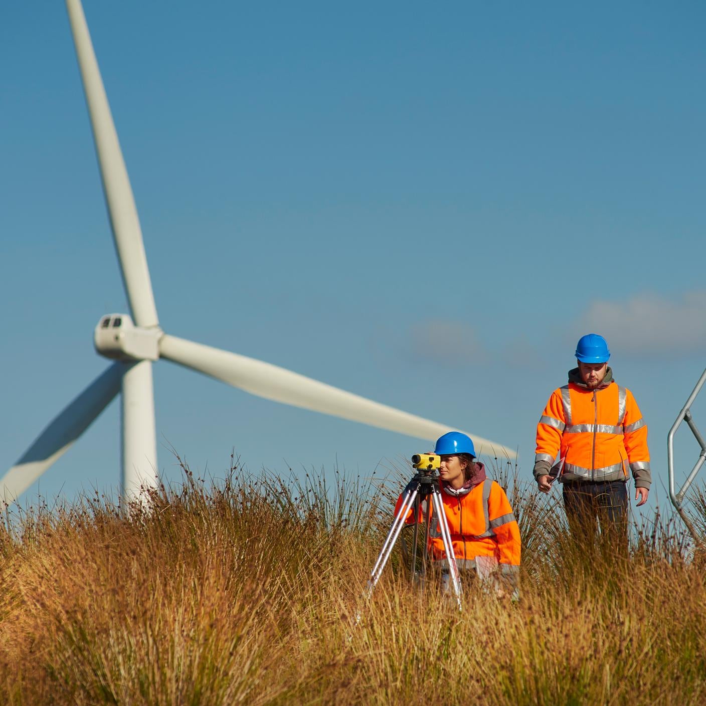 Two energy experts working outside