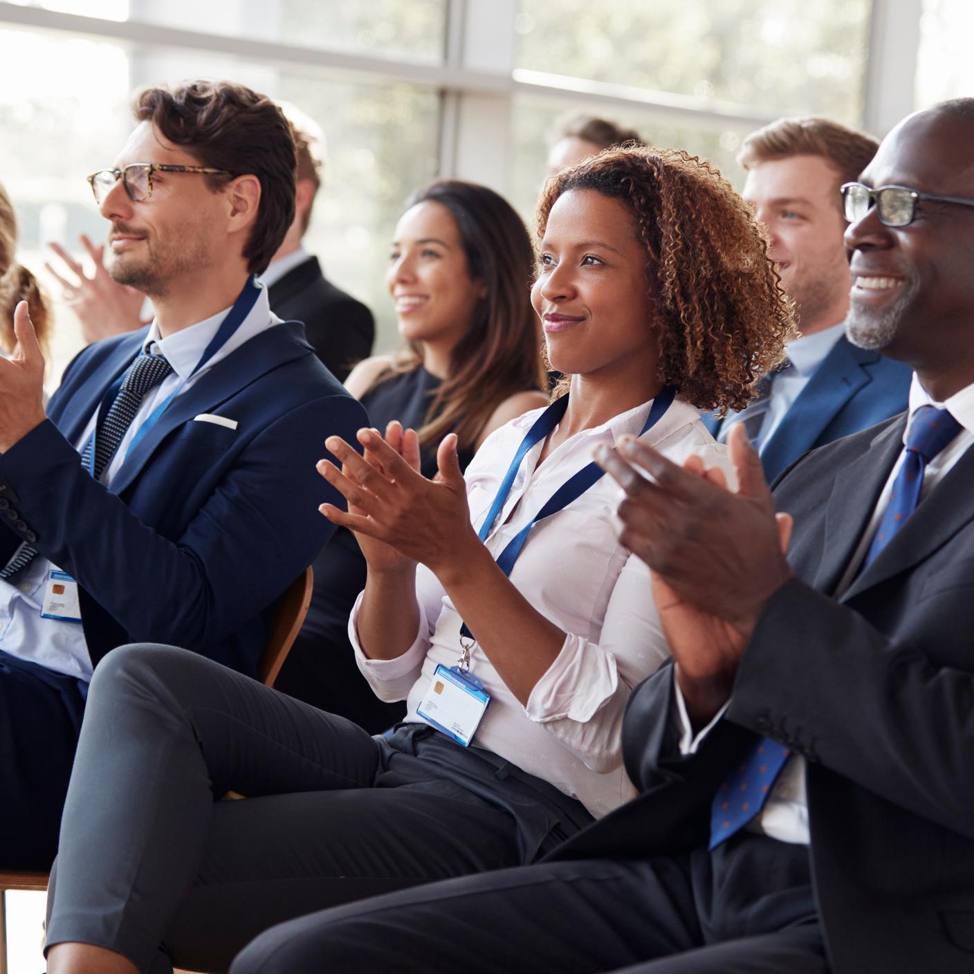 Fees for Conformity Assessment Activities MDR (EUR) - audience applauding at a business seminar