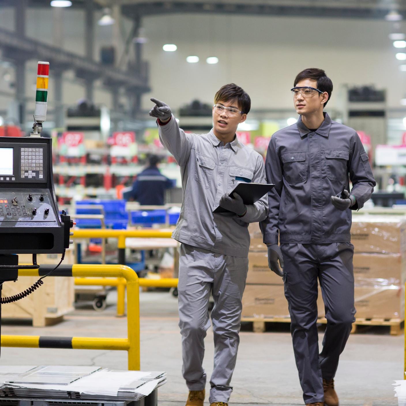 Engineers examining health and safety in a  factory