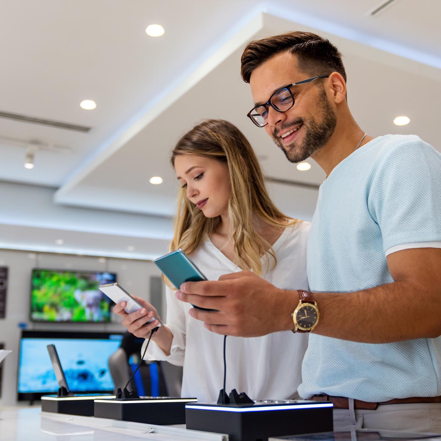 couple smiling with products