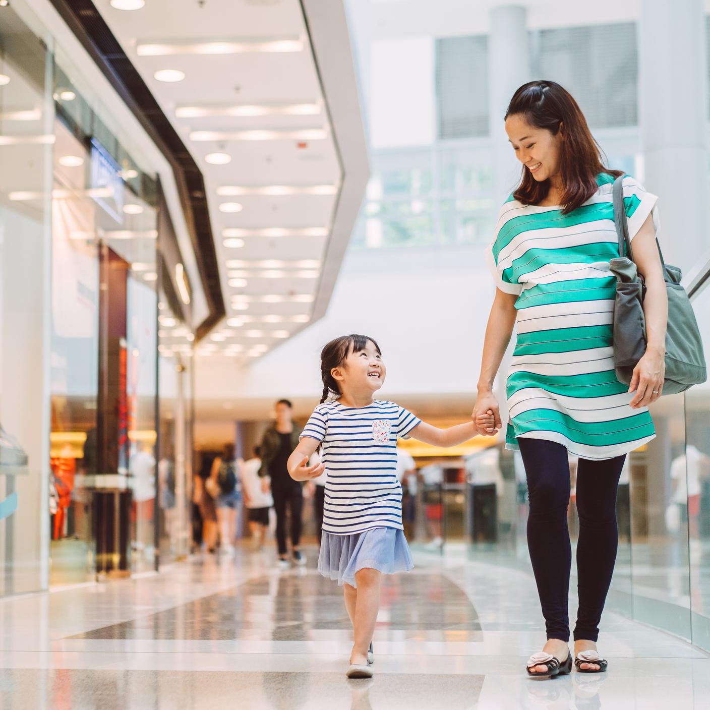 Consumers in the shopping mall joyfully