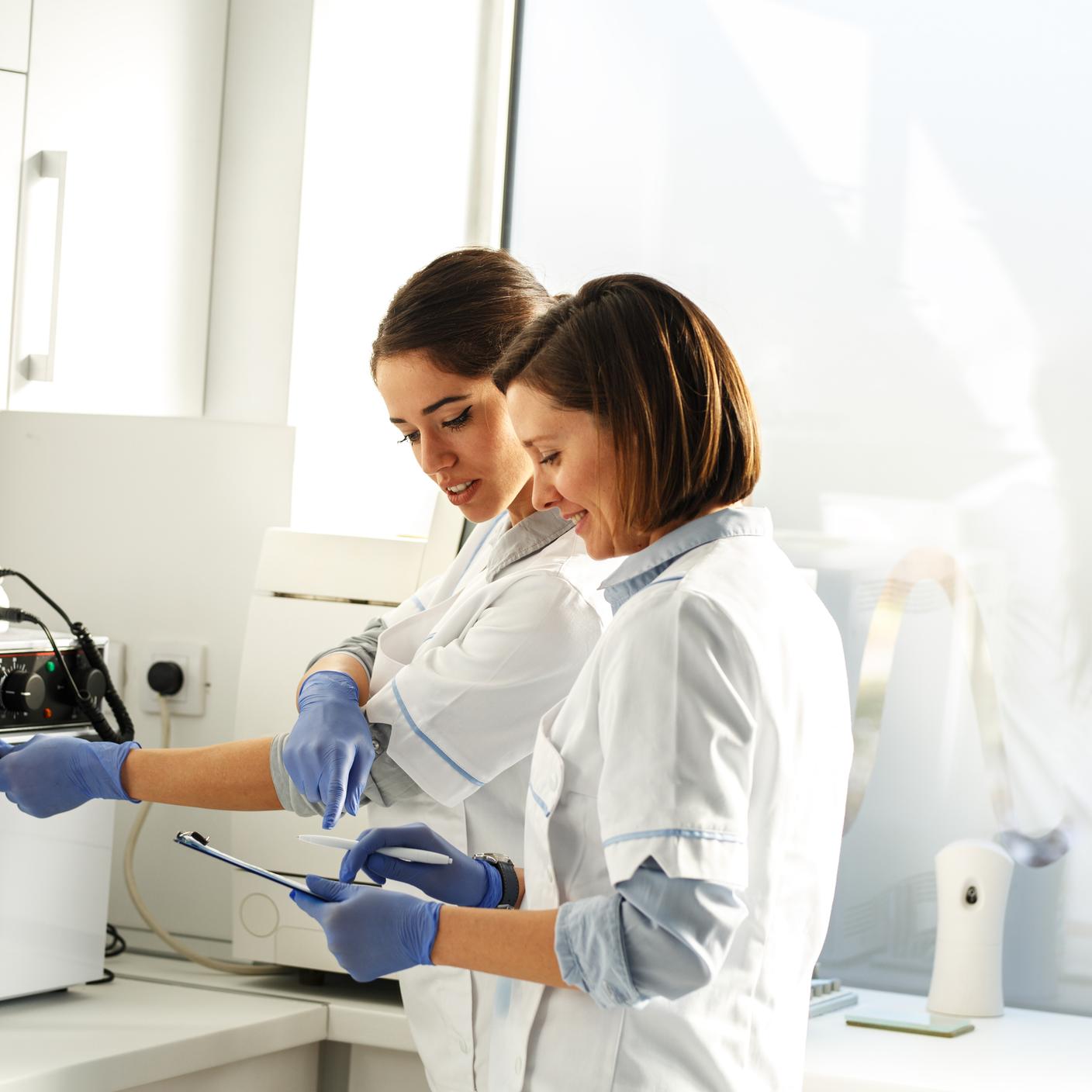 Two woman discussing about medical devices