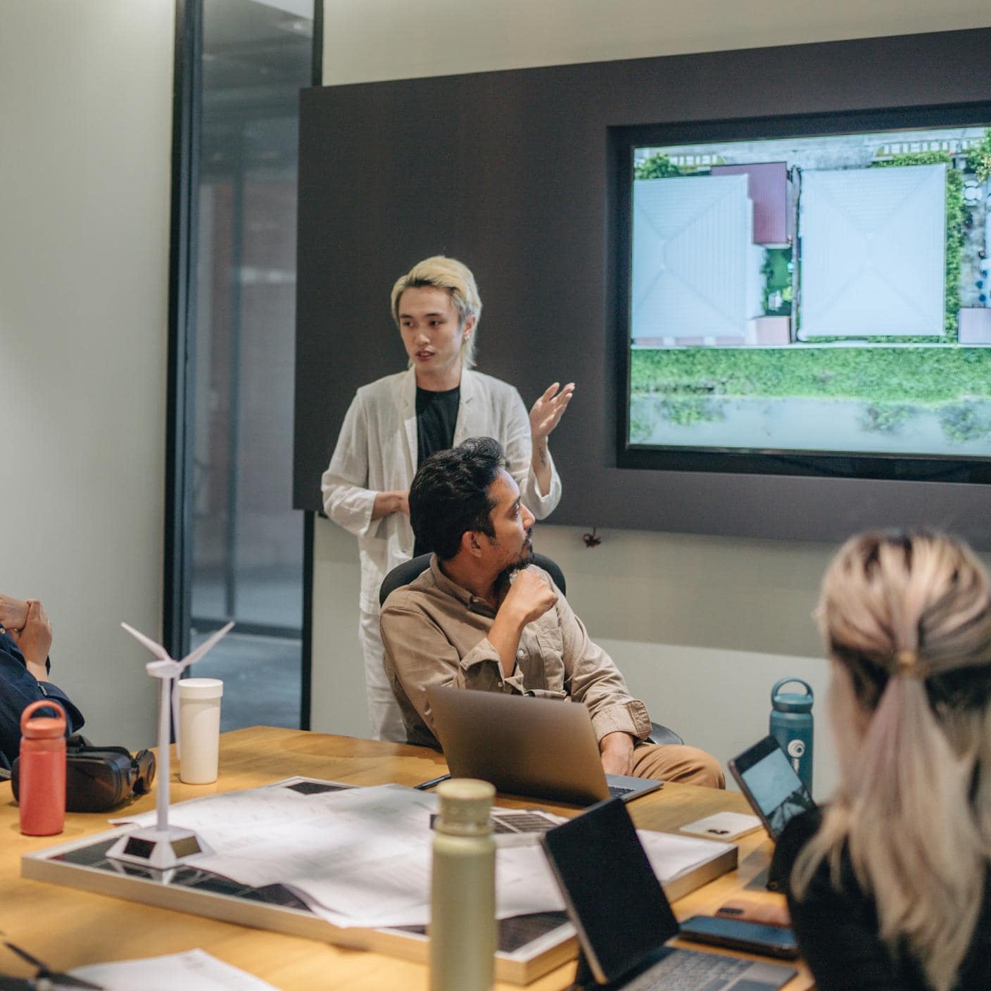 Group of business workers going through a presentation