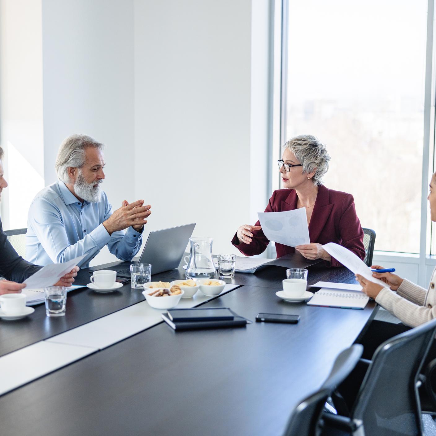 Shot of a group of diverse colleagues having a meeting in a modern office space