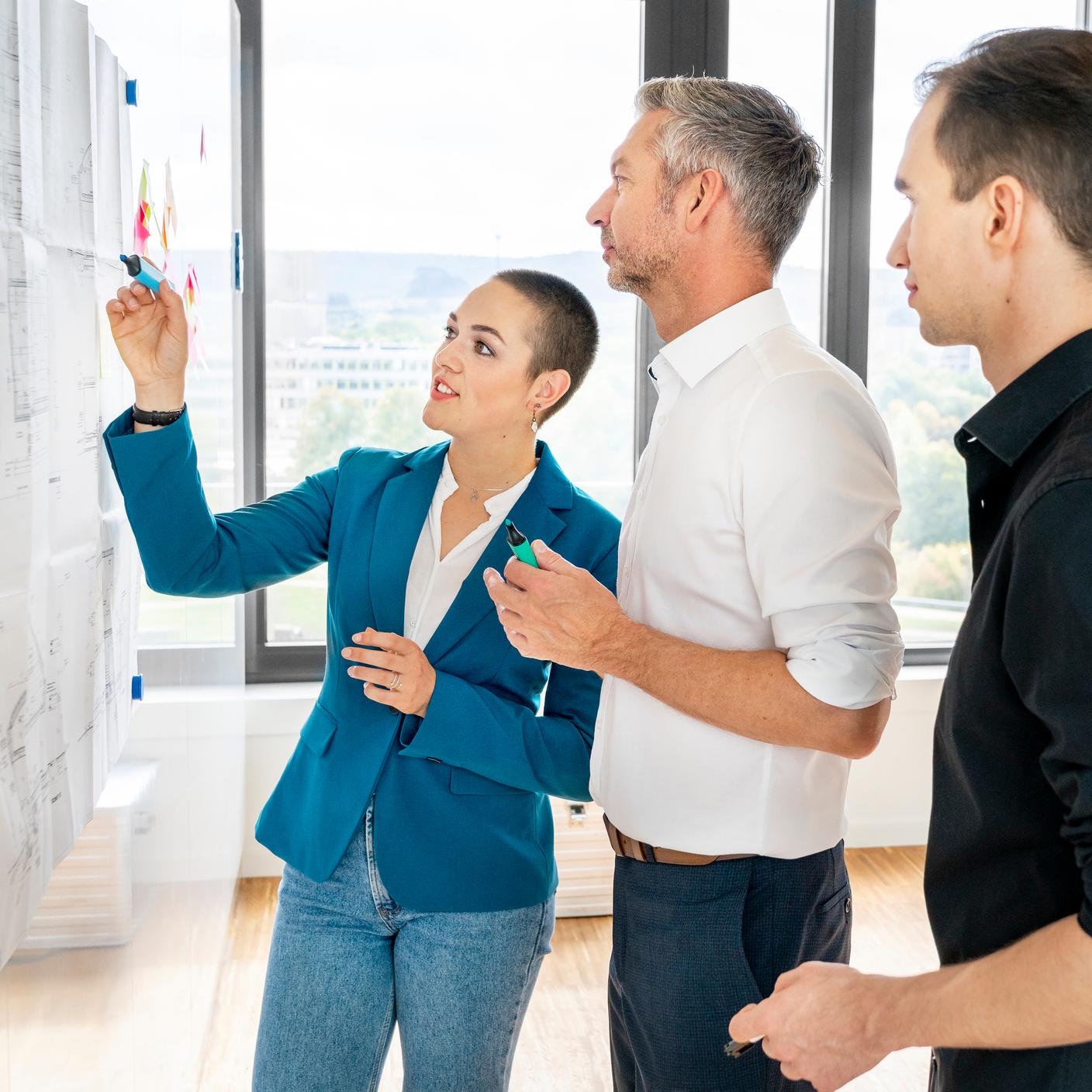 Team of business people brainstorming in office