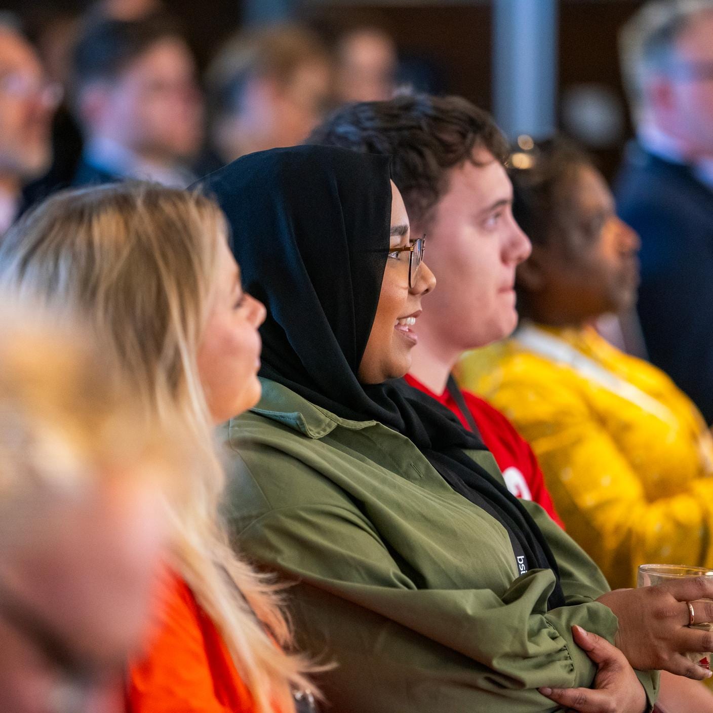 Engaged audience of employees at a company meeting