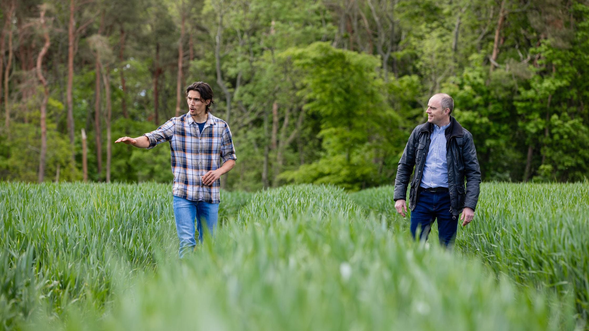 Innovation : A farmer walking through tramlines with a land agent