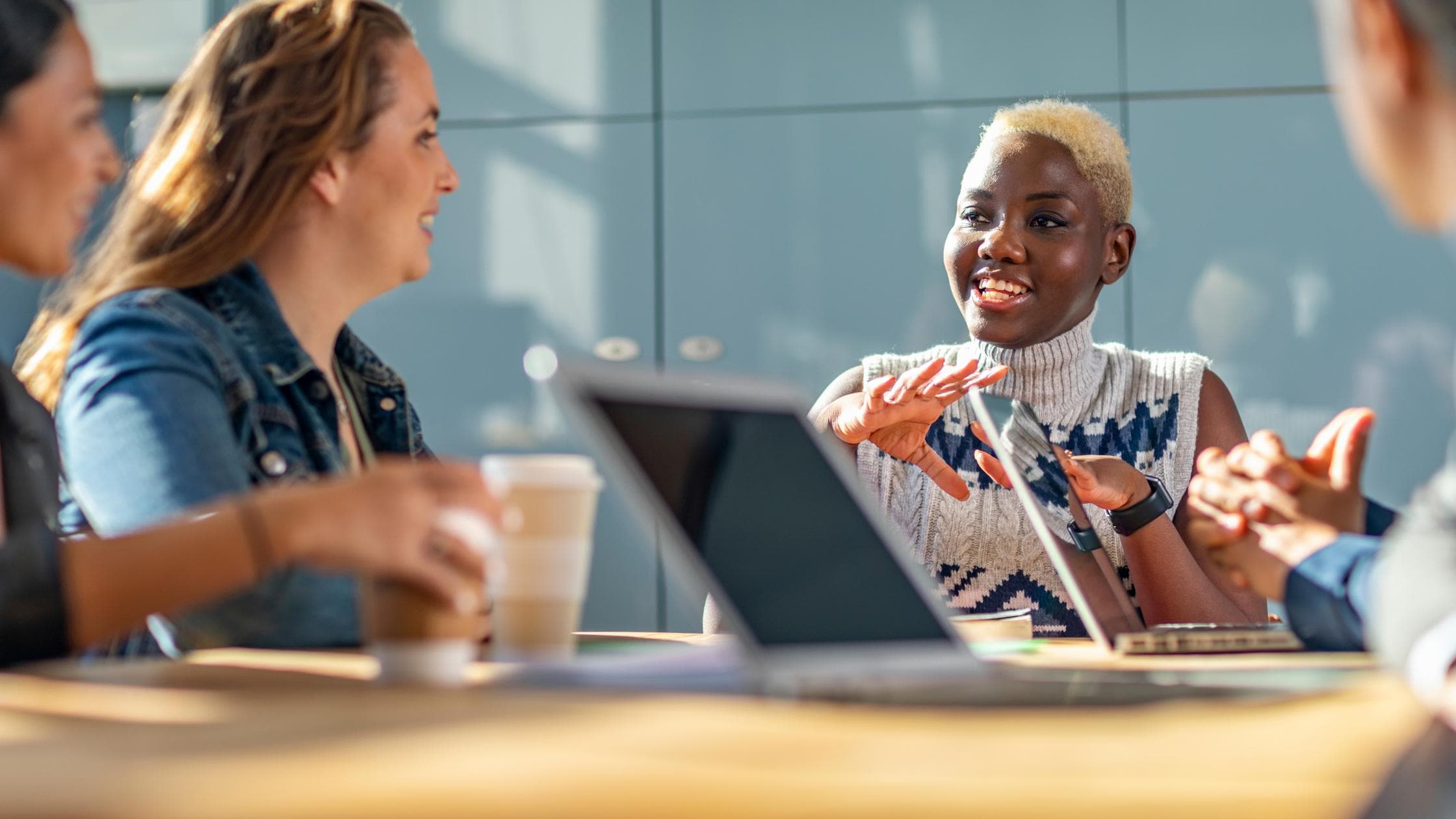 health safety wellbeing woman discussing business meeting