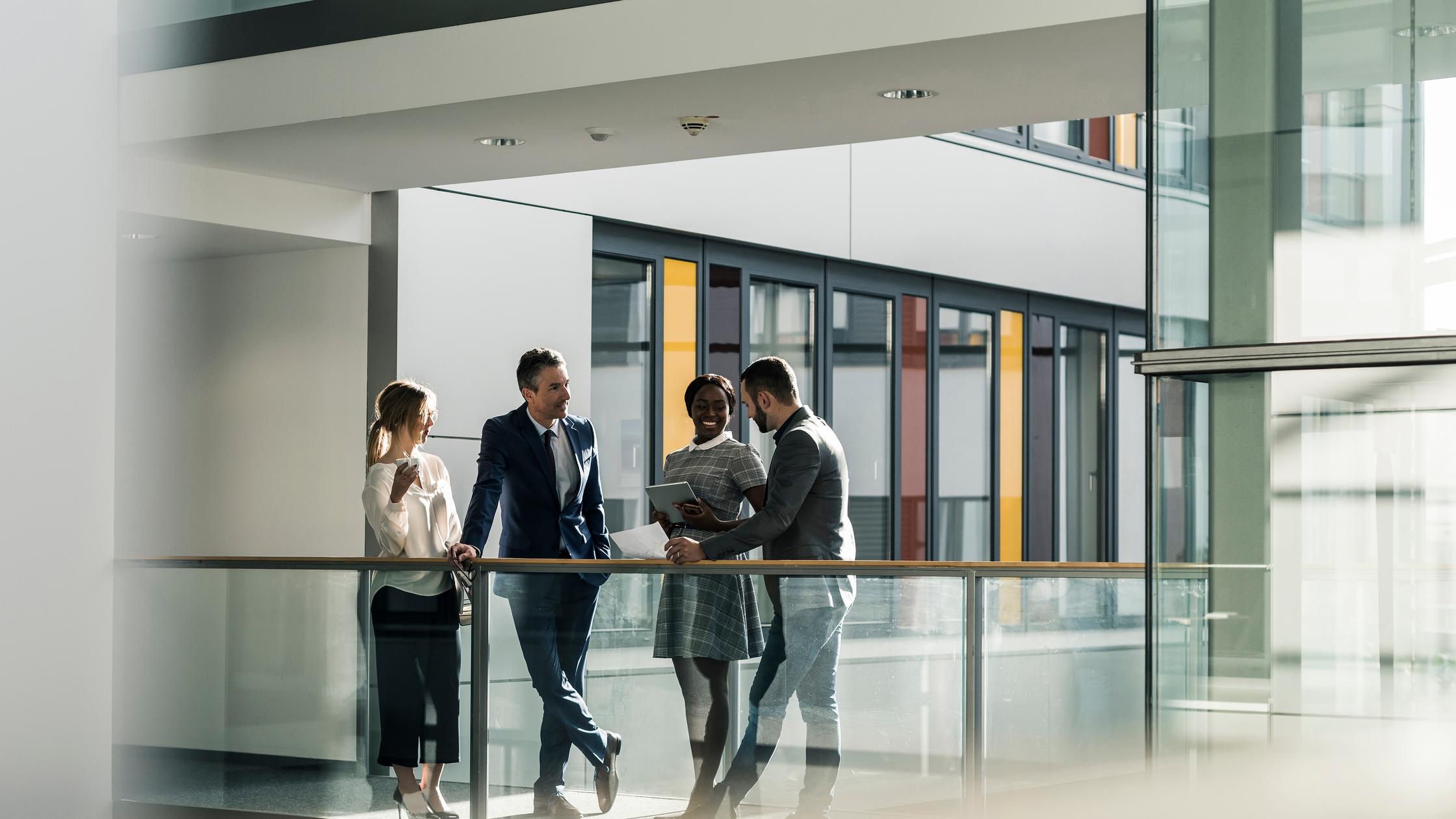 Business people talking on office floor