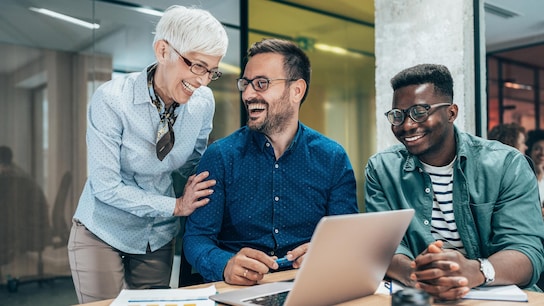  Business people laughing together at work