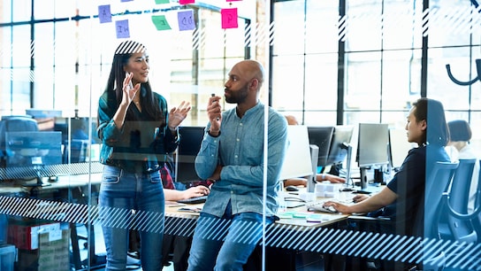  Female and male coworkers brainstorming  